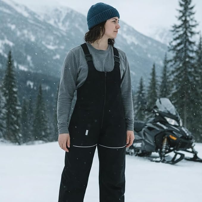 Salopette de ski imperméable et isolée pour femme Escape, avec poches et pantalon de planche à neige ajustable.